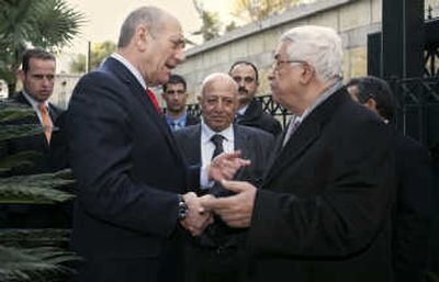 
Israeli Prime Minister Ehud Olmert, left, meets with Palestinian President Mahmoud Abbas in Jerusalem on Thursday  as the two leaders held their first summit since renewing peace talks last month. Associated Press
 (Associated Press / The Spokesman-Review)