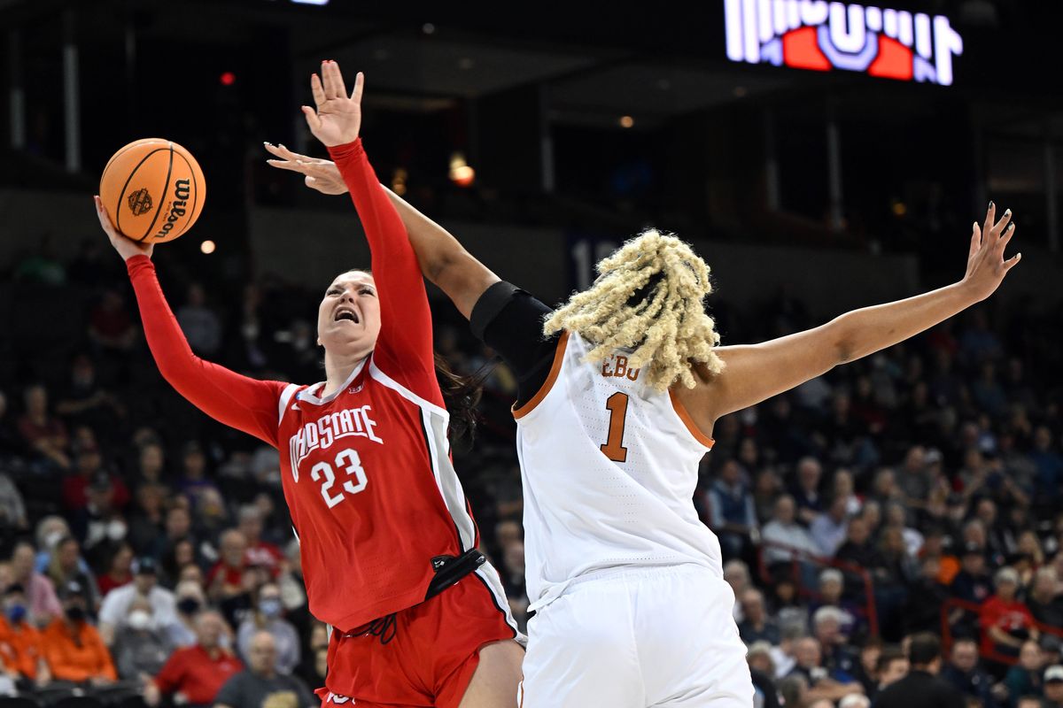 Ohio State forward Rebeka Mikulasikova (23) heads to the basket, as Texas center Lauren Ebo (1) defends during first half of an NCAA women