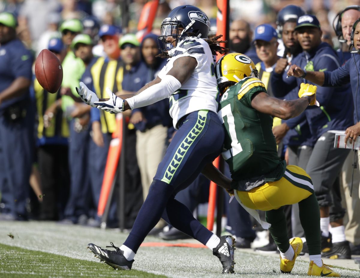 Seattle Seahawks’ Shaquill Griffin breaks up a pass intended for Green Bay Packers’ Davante Adams during the first half of an NFL football game Sunday, Sept. 10, 2017, in Green Bay, Wis. (Jeffrey Phelps / Associated Press)