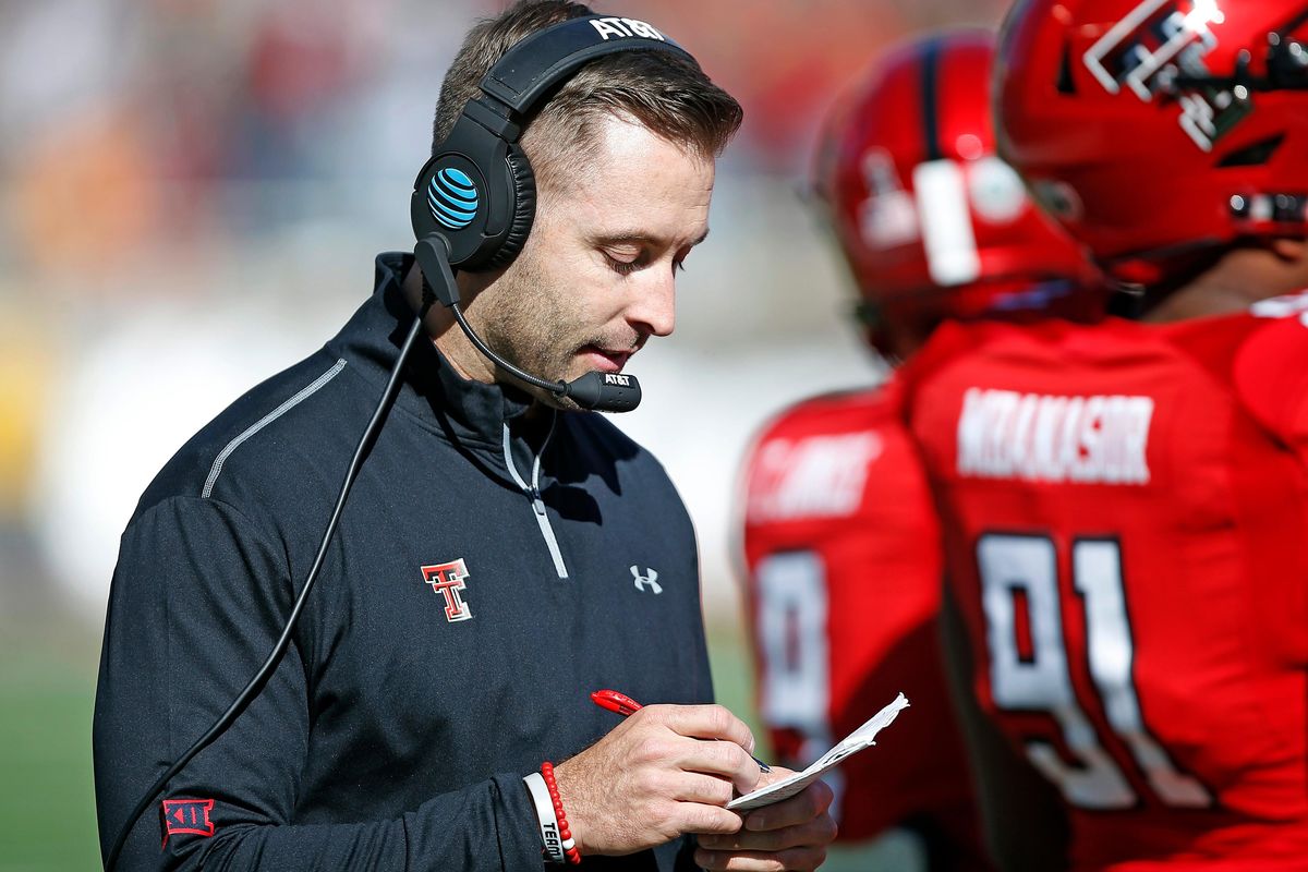 In this Nov. 18, 2017, file photo, Texas Tech coach Kliff Kingsbury looks down at his notes during the second half of the NCAA college football game TCU, in Lubbock, Texas. Kingsbury is still popular at Texas Tech, five years after his hiring as coach unified a fractured football program at his alma mater. (Brad Tollefson / Associated Press)