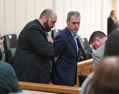 Daniel Howard is handcuffed after being convicted Tuesday of murdering his wife, Kendy Howard, in the second degree.  (Jesse Tinsley/THE SPOKESMAN-REVIEW)