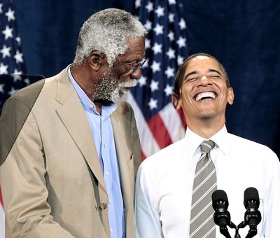 President Barack Obama smiles as he is introduced by NBA basketball hall-of-famer Bill Russell during a fundraiser Sunday at the Paramount Theater in Seattle. (Associated Press)