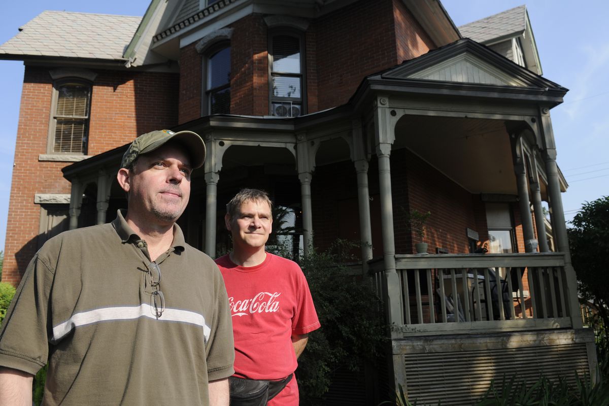 Mike Schultz, left, and Steven Sanford have done most of the refurbishing of the Muzzy Mansion, the historic home in West Central that was built by one of the city’s early homesteaders, Hiram Newton Muzzy.  (Jesse Tinsley)