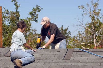 
Repairing roofs of damaged homes is one of the many jobs tackled by Mennonite Disaster Service volunteer construction workers. 
 (Courtesy of Mennonite Disaster Service / The Spokesman-Review)