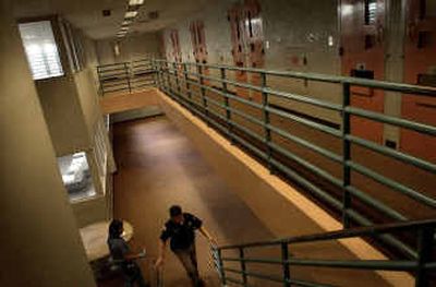 
Spokane County Jail employees work inside a pod at the downtown facility. More than 400 inmates have been released this year because police and prosecutors have failed to do required paperwork in time. 
 (Brian Plonka / The Spokesman-Review)