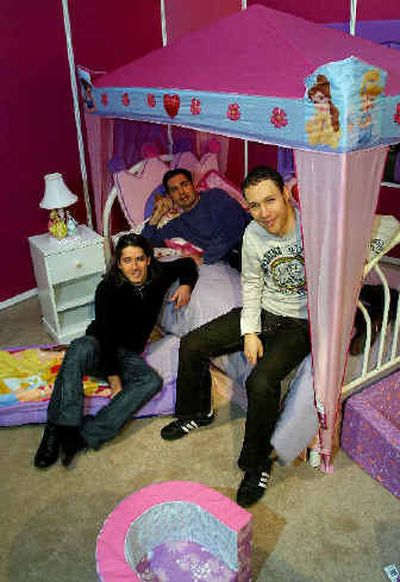 
Spin Master Ltd. Co-CEO's Ronnen Harary, left, Anton Rabie, center, and Ben Varadi, Executive Vice President, sit in their new mock-up Marshmallow Disney Princess bedroom last week in downtown Toronto.
 (Associated Press / The Spokesman-Review)