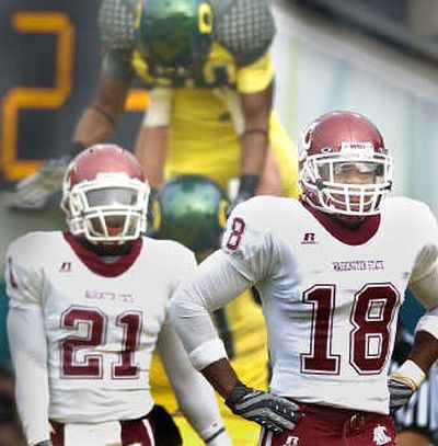 
WSU's Chima Nwachukwu, left, and Alfonso Jackson took a slow walk off the field after another Oregon first-half TD. 
 (Christopher Anderson / The Spokesman-Review)
