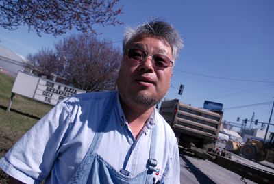 A five-week construction project to repave the intersection of Fancher Road and Broadway Avenue has brought Barnabas Yeo’s business to a standstill.  (PHOTOS BY J. BART RAYNIAK / The Spokesman-Review)