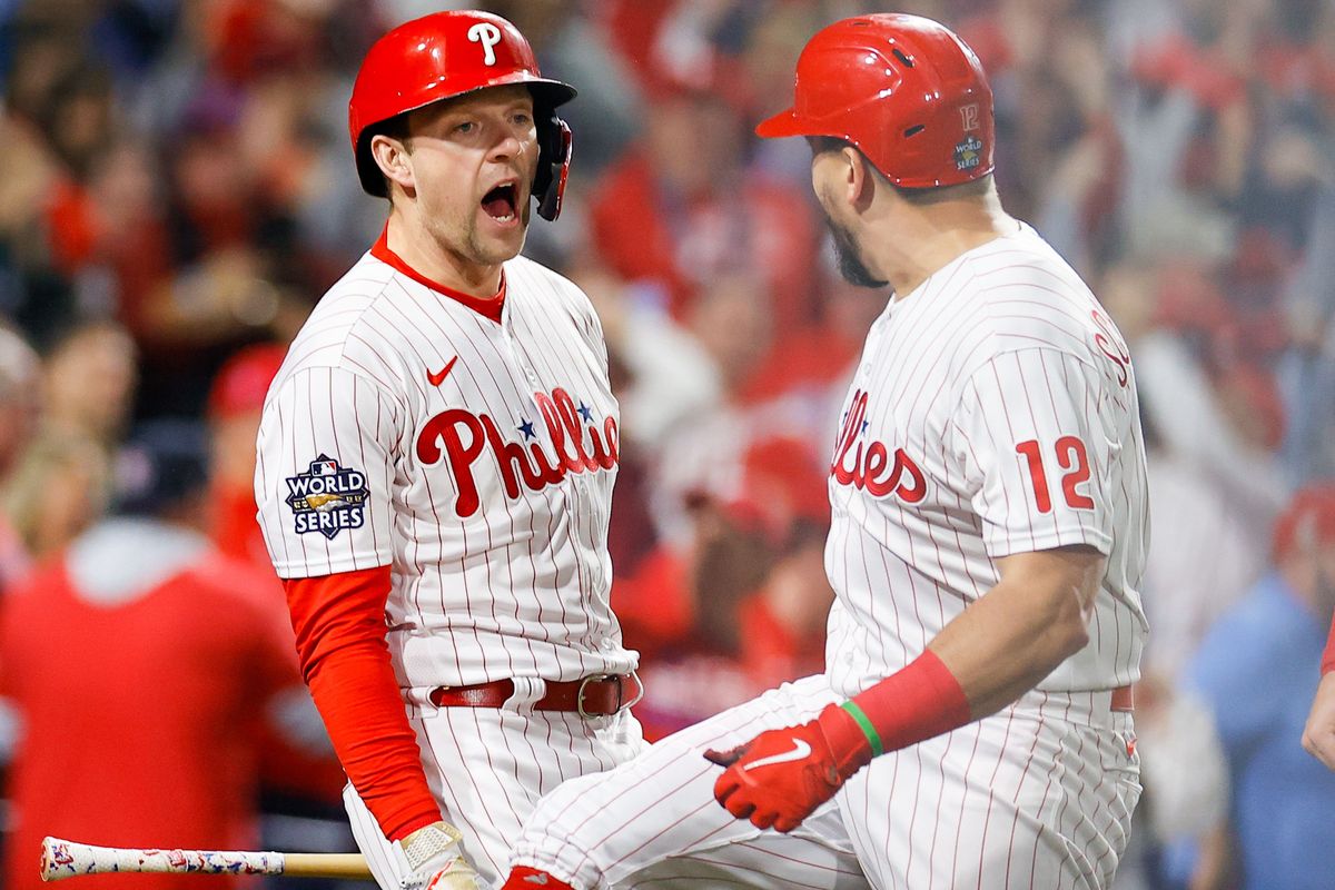 Rhys Hoskins, left, and Kyle Schwarber hit back-to-back home runs in the fifth Tuesday to extend Philadelphia’s lead to 7-0 in Game 3.  (Yong Kim / Staff Photographer)