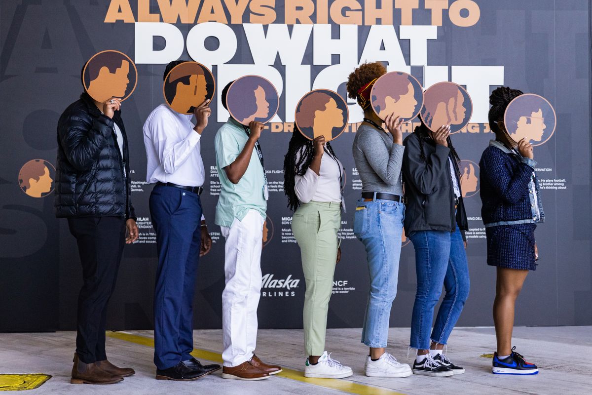 {span}Children of Alaska Airlines employees, standing in a line, will have their likenesses appear on the side of “Our Commitment,” a new Boeing 737 designed to represent the company’s racial diversity and inclusion goals.”{/span}  (Ingrid Barrentine/Alaska Airlines)