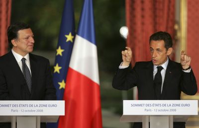 French President Nicolas Sarkozy delivers a speech following a crisis summit at the Élysée Palace in Paris on Sunday. At left is E.U. Commission president Jose-Manuel Barroso.  (Associated Press / The Spokesman-Review)