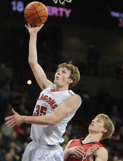 St. George’s Will Tender shoots against Liberty in Friday’s semi in which Tender finished with 23 points. (Tyler Tjomsland)