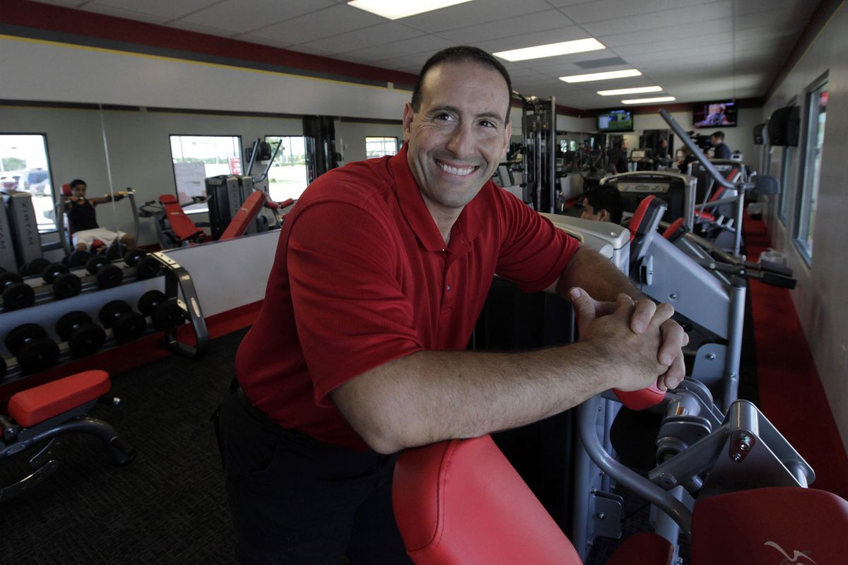 In this June 14, 2012, photo, Rick Limitone, manager of Snap Fitness, posses for a photo at the truck stop gym in Dallas. From trucking companies embracing wellness and weight-loss programs to gyms being installed at truck stops, momentum has picked up in recent years to help those who make their living driving big rigs get into shape. (Lm Otero / Associated Press)