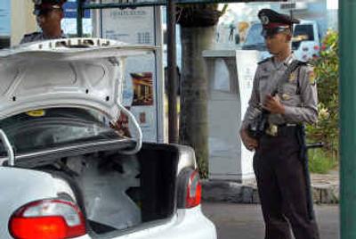 
Indonesia Police officers guard during security check at the entrance of the Jakarta Hilton Hotel, last week in Jakarta, Indonesia. Terrorists are ready to carry out an attack in Indonesia, possibly targeting a Hilton hotel, Australia warned on Dec. 15. 
 (Associated Press / The Spokesman-Review)
