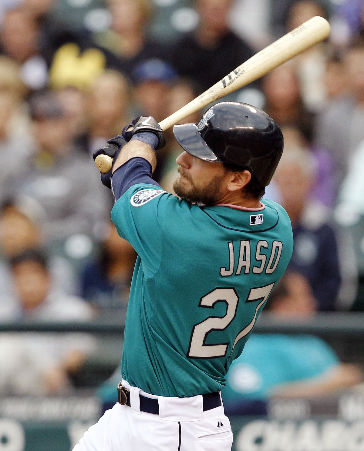 M’s John Jaso watches his 3-run homer in first inning. (Associated Press)
