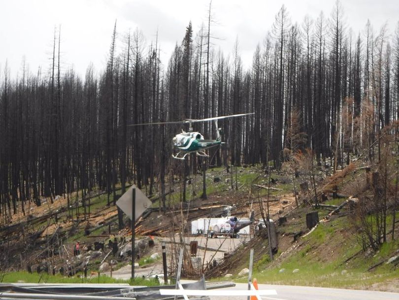 Helicopter crews drop straw and seed to help check erosion in the wake of the 2015 wildfires in the Colville National Forest. (Holly Weiler)