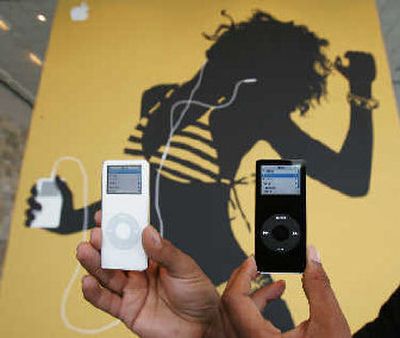 
Boosted by strong iPod sales, Apple Computer Inc. posted another another record-revenue quarter on Wednesday. 
 (Associated Press / The Spokesman-Review)