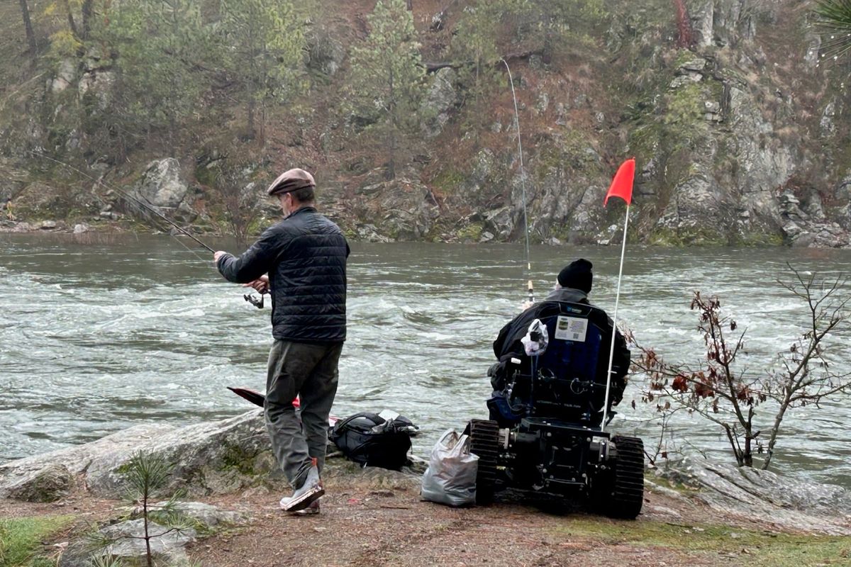 Anglers fish the Spokane River at Riverside State Park while using a track chair that Washington State Parks has made available by reservation.  (Courtesy of Washington State Parks)