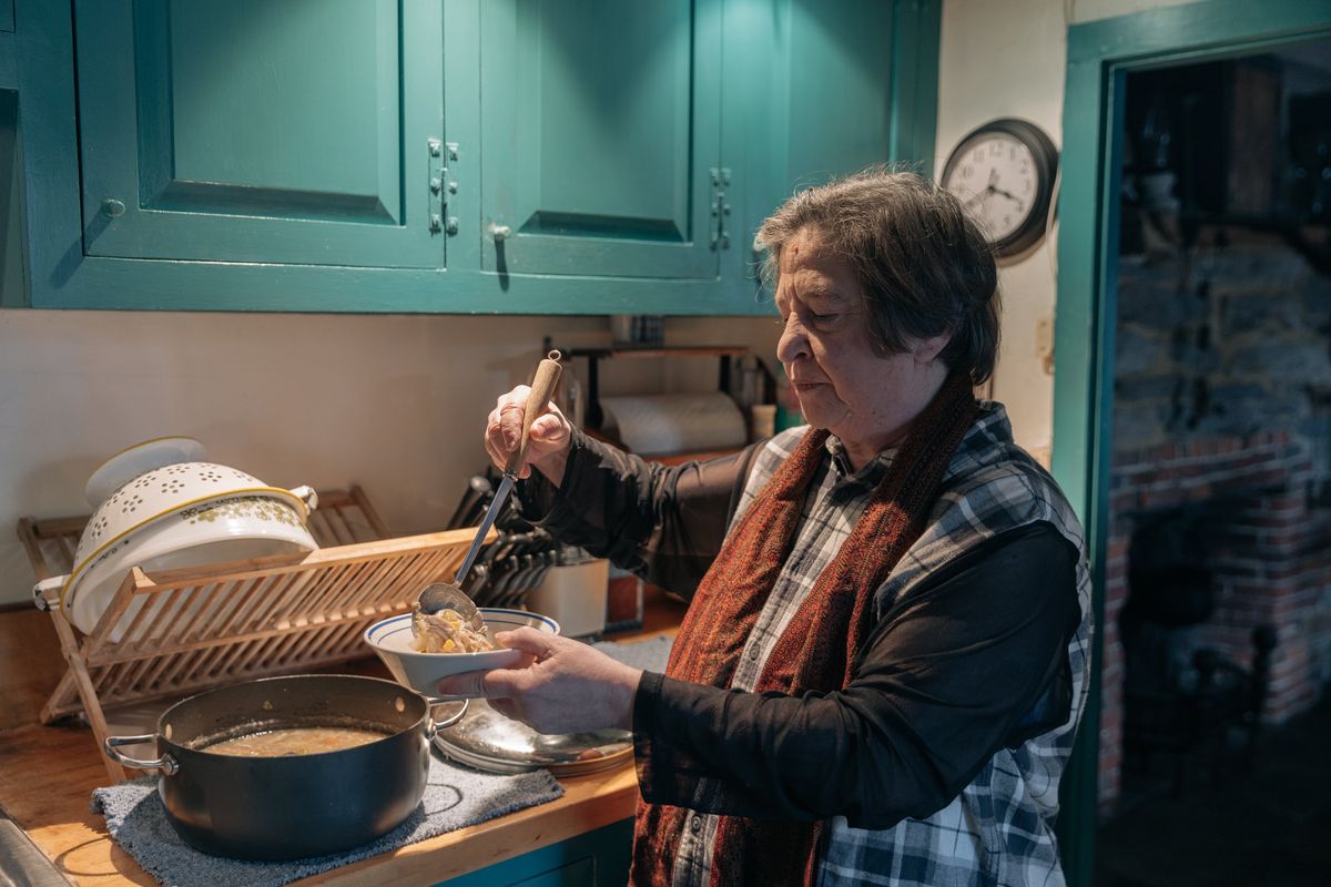 Sharon Cohen prepares lunch at home in Newtown, Conn., on Jan. 21, 2023. As costs rise, many older Americans have changed the way they shop and eat out, and for some, it could affect their health or leave them feeling isolated.   (JEENAH MOON/New York Times)