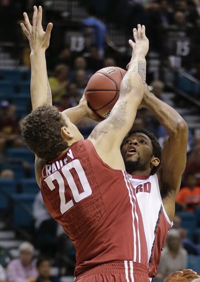 Stanford’s Chasson Randle, right, puts up shot against Washington State’s Jordan Railey during first half. (Associated Press)