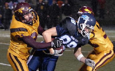 
Gonzaga Prep's Phil Joy fights for yardage against Moses Lake. 
 (Dan Pelle / The Spokesman-Review)