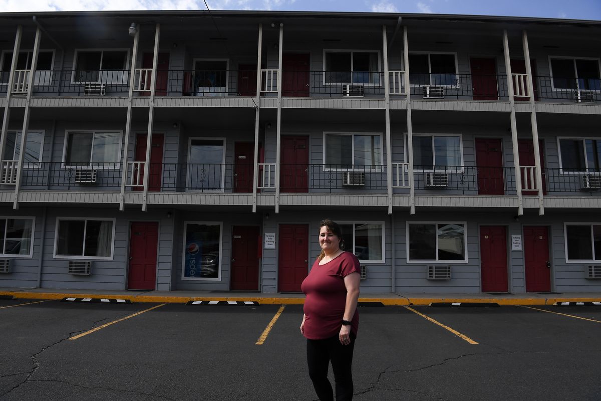 Teresa Becker manager of Cougar Land Motel poses for a photo in front of rooms that are normally completely booked out on WSU football weekends on Thursday, Aug. 13, 2020, outside Pullman, Wash. Becker expects the hotel won’t survive without college football this fall.  (Tyler Tjomsland/THE SPOKESMAN-REVIEW)