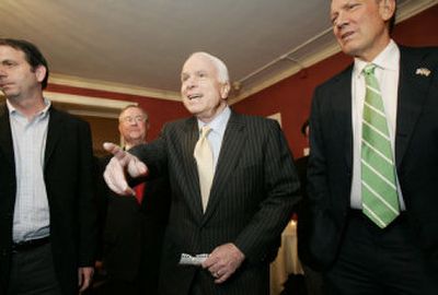 
Sen. John McCain of Arizona, center, arrives with former New York Gov. George Pataki, right,  at an awards reception Wednesday in New York. 
 (Associated Press / The Spokesman-Review)