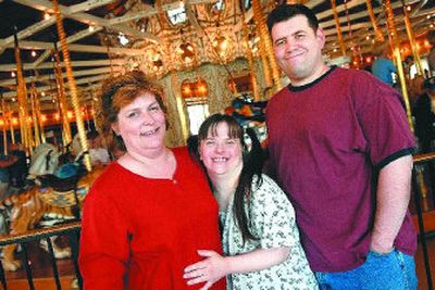
Left to right, Deborah,  Sueann and Robert Osborn pose near the Riverfront Park Carrousel. 
 (Holly Pickett / The Spokesman-Review)