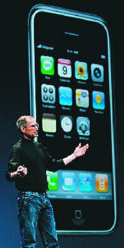 Apple CEO Steve Jobs shows off the iPhone in this photo taken Jan. 9 at the MacWorld Conference & Expo in San Francisco. Competitors are skeptical of Apple's claims that the iPhone is 