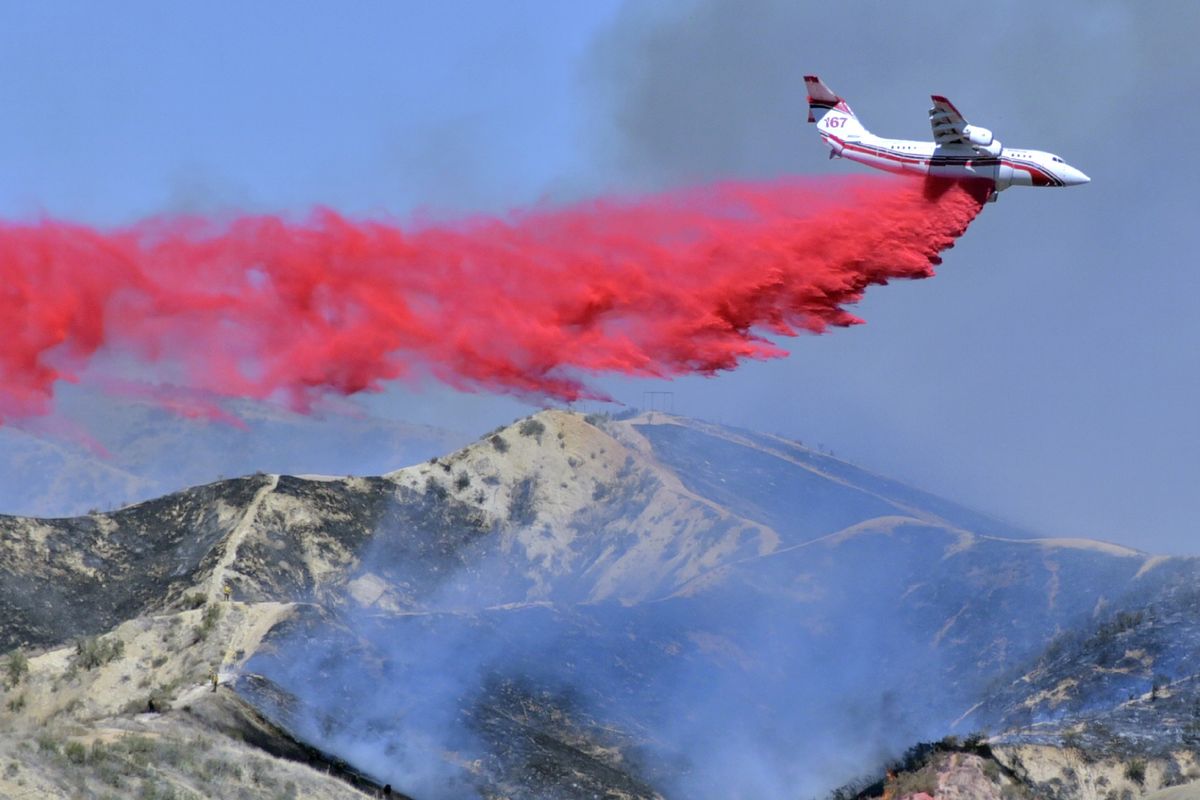 A fixed-wing tanker makes a drop of fire retardant on the North Fire on April 28 in Castaic, Calif.  (Dan Watson)