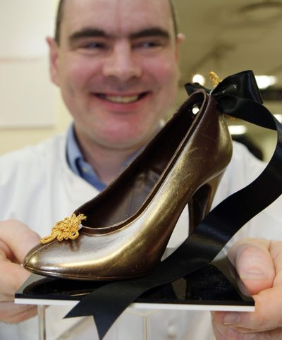 ORG XMIT: TOK101 Gerard Coleman, chocolatier and co-founder of L'Artisan du Chocolat in London. shows one of his collection made of chocolate during a press preview of a chocolate fair at a department store in Tokyo, Japan, Tuesday, Jan. 20, 2009. (AP Photo/Shizuo Kambayashi) (Shizuo Kambayashi / The Spokesman-Review)
