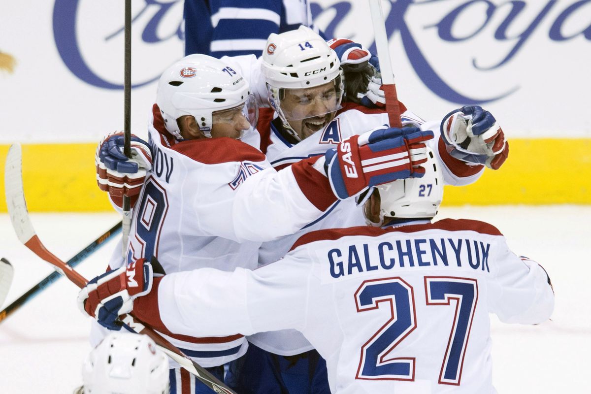 Montreal’s Tomas Plekanec, center, celebrates his late winning goal with his teammates Wednesday. (Associated Press)