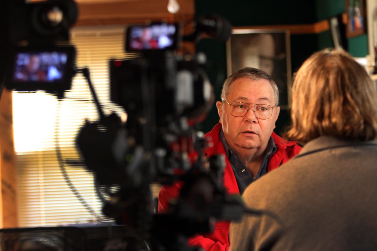 Retired sheriff's deputy Paul Main poses in his shop at his home Tuesday, Oct. 16, 2012 in Alfred, Maine. Main's phone has been ringing off the hook since a person with his same name, accused of visiting a prostitute in Kennebunk, was released on Monday. (Jim Cole / Associated Press)