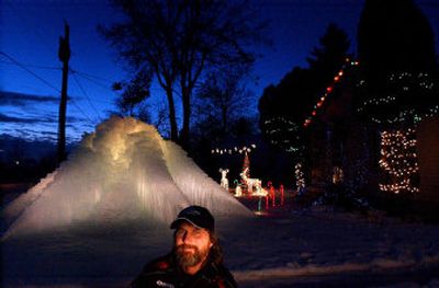 
Every year, Dave VanVlaenderen of Spokane Valley creates an ice mountain in his yard with wires and dripping water. The internal lighting is done with a floodlight in an entombed Frosty the Snowman.
 (Brian Plonka / The Spokesman-Review)