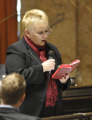 OLYMPIA -- Rep. Susan Fagan reads from a copy of the state Constitution during a debate in the House of Representatives on Feb. 1, 2013 (Jim Camden)