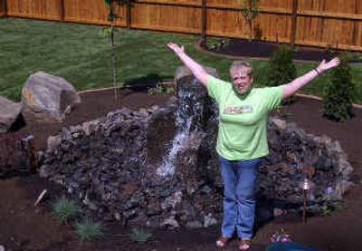 
One of Tracy Stiles' favorite parts of her new back yard is the water fountain. Stiles received over $70,000 in exterior home and yard improvements courtesy of KXLY and about 30 contractors who donated the labor and materials. 
 (Liz Kishimoto / The Spokesman-Review)