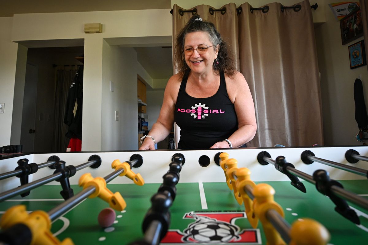 Shari Davis practices her foosball skills on May 1 on a professional Tornado foosball table at her north Spokane home. Davis, who began traveling to major competitions just a few years ago, recently qualified for the international championships in Spain this summer.  (Jesse Tinsley/THE SPOKESMAN-REVIEW)