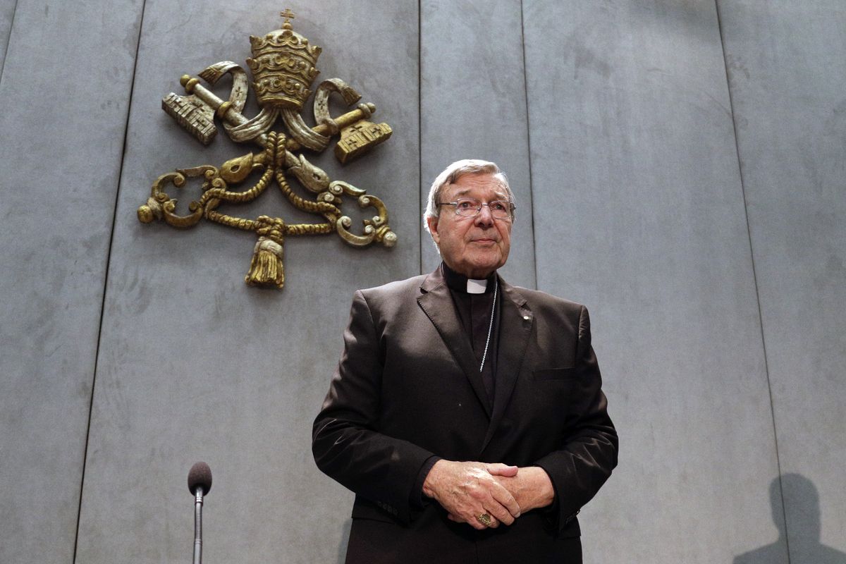 FILE - In this Thursday, June 29, 2017 file photo, Cardinal George Pell arrives to make a statement, at the Vatican, Thursday, June 29, 2017. Cardinal George Pell, the former Vatican finance minister who was convicted and then absolved of sexual abuse in his native Australia, is set to publish his prison diary musing on life in solitary confinement, the Psalms, the church, politics and sports. Catholic publisher Ignatius Press told The Associated Press on Saturday the first installment of the 1,000-page diary would likely be published in Spring 2021.  (Gregorio Borgia)