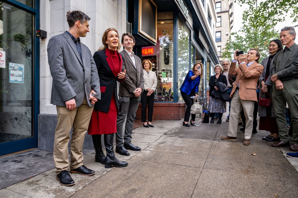 Mary Crosby, with her two sons Benjamin and Christopher Crosby-Brodka talks about her father Bing Crosby after a plaque was dedicated on the side of the Symons building where Spokane’s first radio station broadcast Crosby’s songs. After the dedication on Friday, an honorary Bing Crosby Way sign designating two blocks of West Sprague was unveiled. (COLIN MULVANY /THE SPOKESMAN-REVIEW)