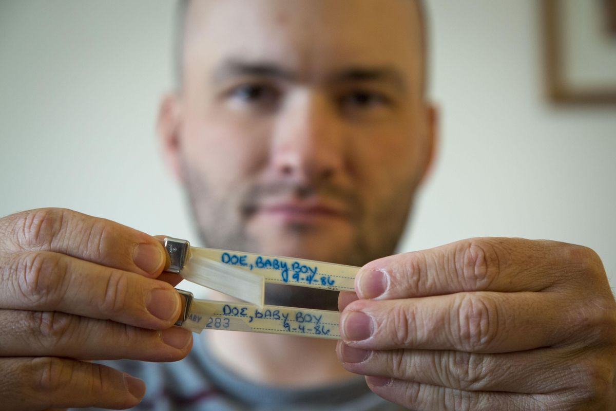 Benjamin Tveidt, 29, who was abandoned as a baby on a busy road in Anchorage, Alaska, displays his hospital bracelet in Boise, where he now lives, on April 22. Tveidt has few mementos from his babyhood, except the wrist bracelets from the hospital, naming him “Baby Boy Doe.” (Katherine Jones / Idaho Statesman)