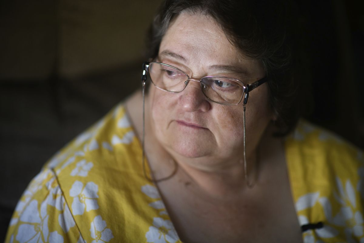 Doris Kelley, 57, sits in her home on June 29 in Ruffs Dale, Pa. Kelley was one of the first patients in a University of Pittsburgh Medical Center trial for COVID-19. “It felt like someone was sitting on my chest and I couldn’t get any air,” Kelley said of the disease. (Justin Merriman)