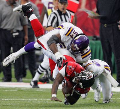
Minnesota Vikings linebacker Dontarrious Thomas (54) and cornerback Antoine Winfield are part of a struggling defense. 
 (Associated Press / The Spokesman-Review)
