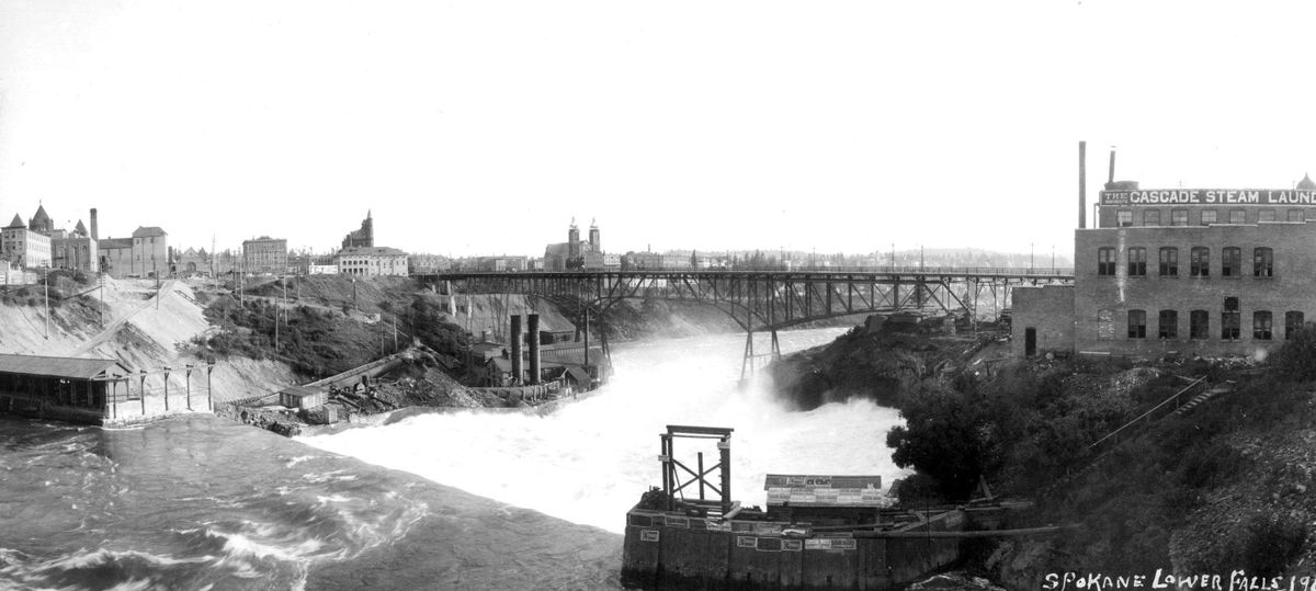 This is a 1907 photo of the Spokane River Lower Falls. View is looking to the west with downtown Spokane on the left. The Cascade Steam laundry is the prominent structure on the north bank of the river. Cascade was established in Spokane in 1890.  (THE SPOKESMAN-REVIEW PHOTO ARCHIVE)