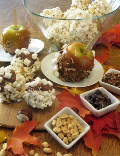 Embellish popcorn balls or caramel apples with toffee, pecans, chocolate chips and marshmallows for an updated twist on classic treats. (Adriana Janovich)