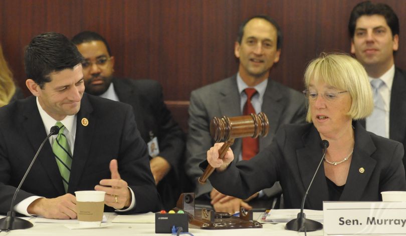 WASHINGTON -- Sen. Patty Murray gives Rep. Paul Ryan a gavel to run the Budget Conference Committee, upholding a tradition of alternating control between the Senate and House with each new conference committee. (Jim Camden)