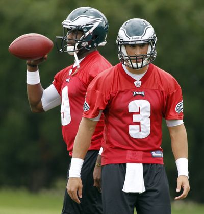 Philadelphia signed QB Vince Young, left, to back up Michael Vick, but Mike Kafka, right, had to step in. (Associated Press)