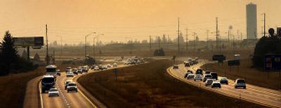 
Traffic flows near Post Falls last week as commuters travel to their destinations along Interstate 90. 
 (Brian Plonka / The Spokesman-Review)