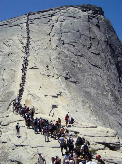 Tourists climb Half Dome at Yosemite National Park, Calif., in 2006. (Associated Press)