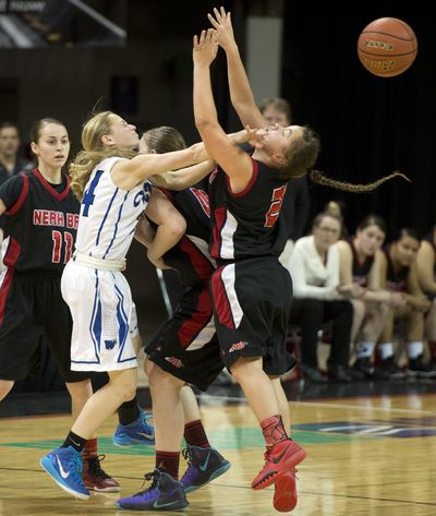 Colton’s Kendyl Druffel, left, passes the ball to beat the half-court pressure of Neah Bay’s Gina McCaulley. (Dan Pelle)