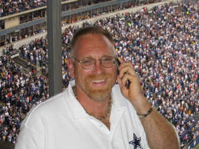 
Dave Rapp calls his brother from a luxury box at a Dallas Cowboys home game in October. The game tickets were a surprise gift from his wife, Judy, for their 25th wedding anniversary. Rapp died Feb. 16. He was 46.
 (Photo courtesy of family / The Spokesman-Review)